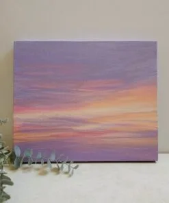 An abstract painting of a sunset sky with yellows, oranges, and pinks peaking through the purple sky to create a beautiful abstract sunset.