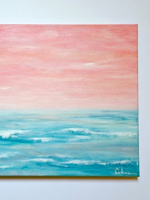 An abstract seascape acrylic painting featuring beautiful peach sunset sky with the horizon blending softly into the teal waters of the ocean.